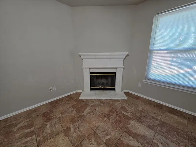 a view of a livingroom with a ceiling fan and window