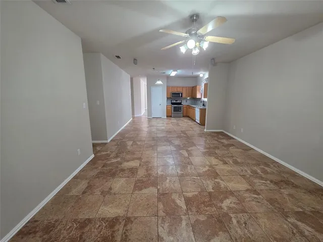 a bathroom with a granite countertop sink toilet a mirror and shower
