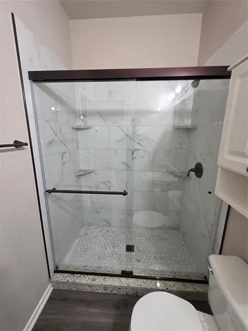 a bathroom with a sink toilet and mirror