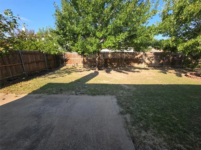 a view of a backyard of the house