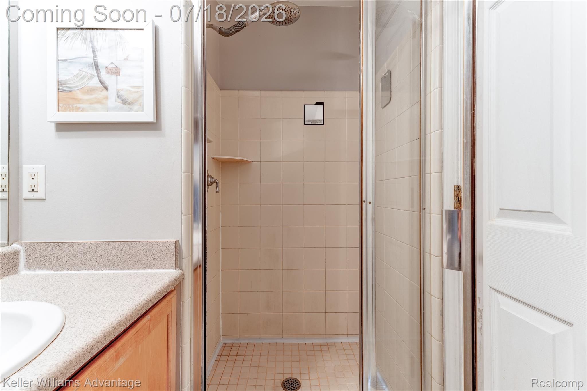 41647 Mitchell Road Novi, MI 48377 - Photo 35 of 43 Glass-enclosed shower with square tile surround and coordinating floor