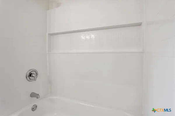 a kitchen with a sink and a stove top oven