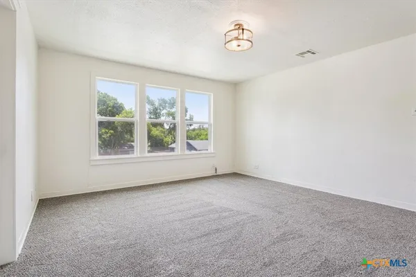 a kitchen that has a sink and a window