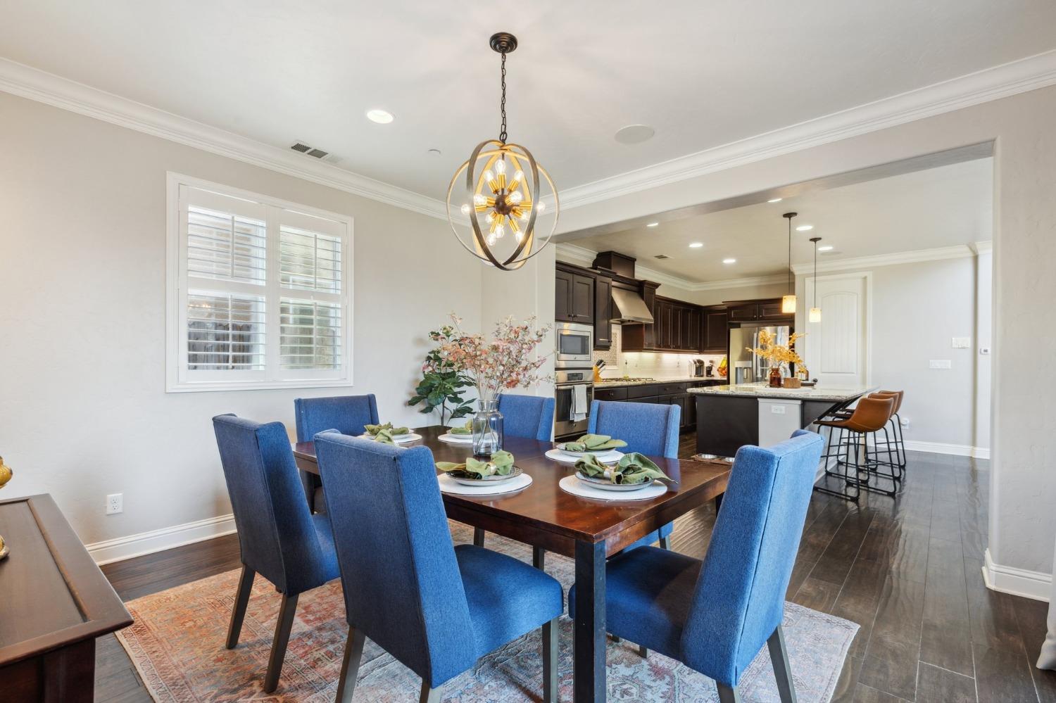4217 Salem Lane Clovis, CA 93619 - Photo 15 of 57 a view of a dining room with furniture window and wooden floor