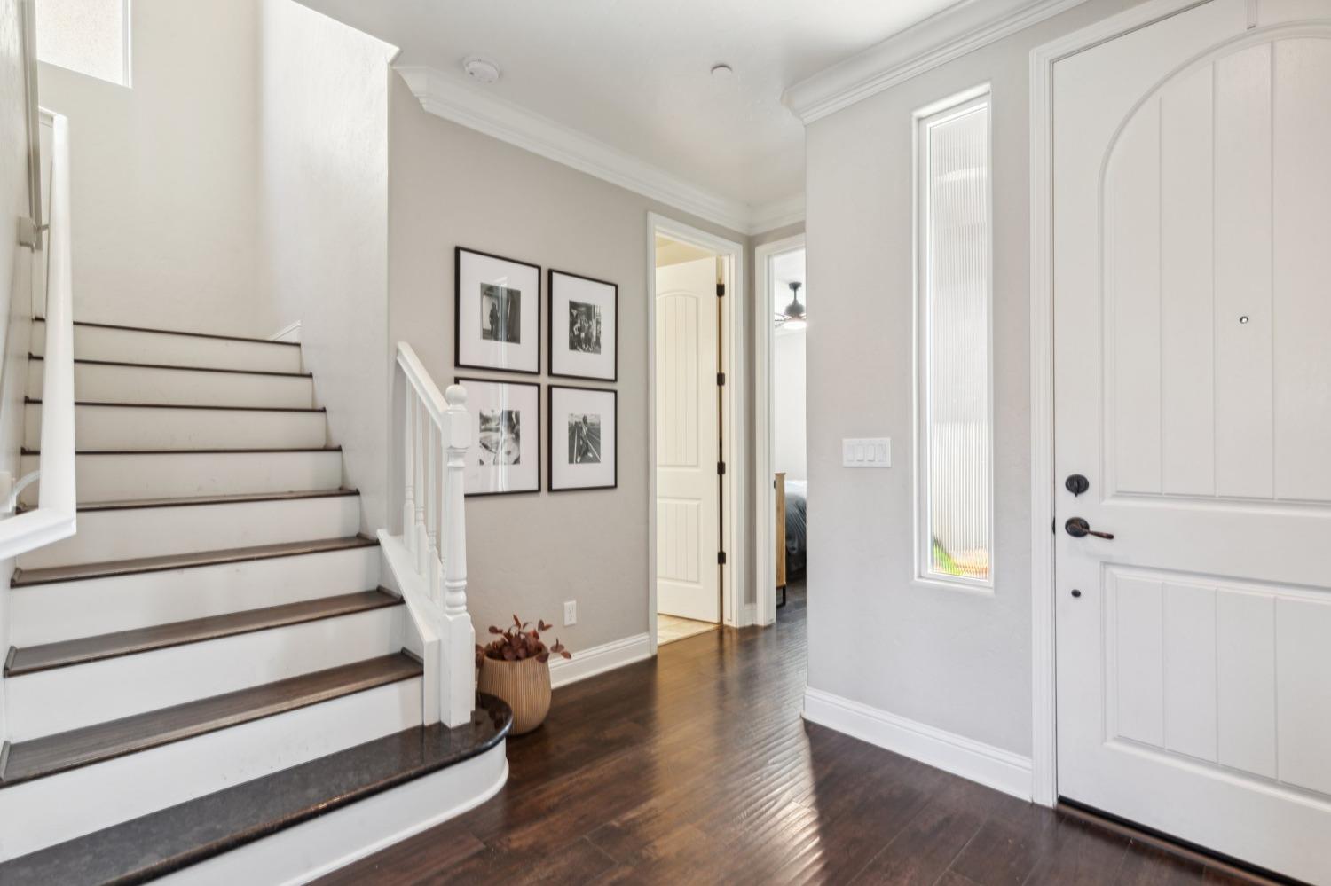 4217 Salem Lane Clovis, CA 93619 - Photo 16 of 57 a view of entryway with wooden floor and stairs