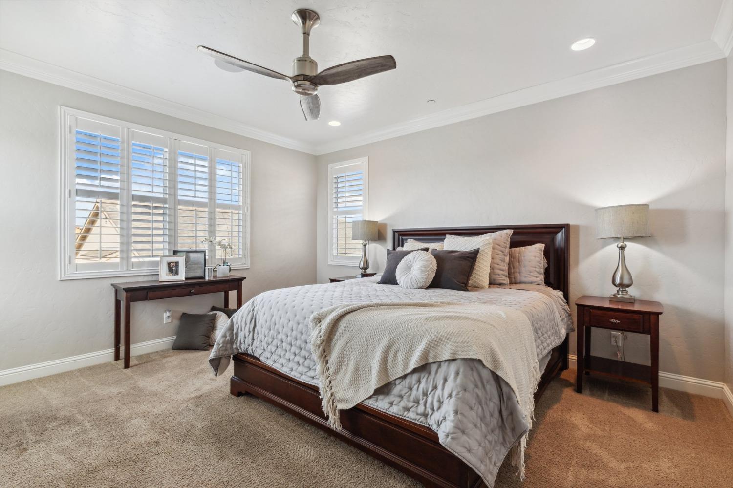 4217 Salem Lane Clovis, CA 93619 - Photo 19 of 57 a bedroom with a bed and a table in it
