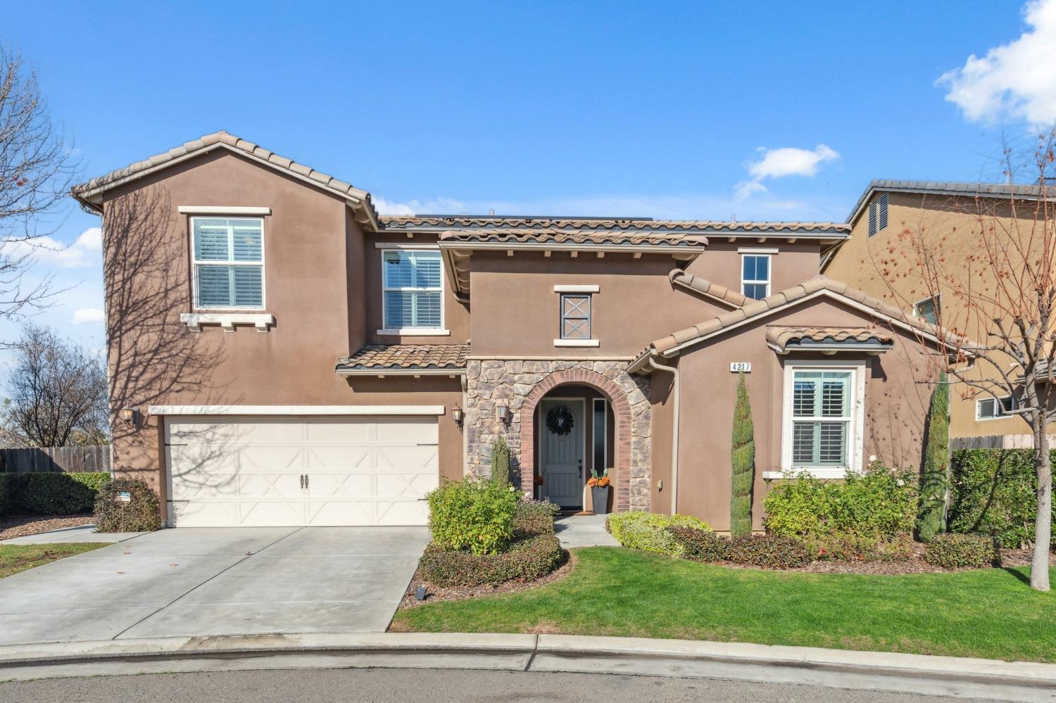4217 Salem Lane Clovis, CA 93619 - Photo 2 of 57 a front view of a house with a yard