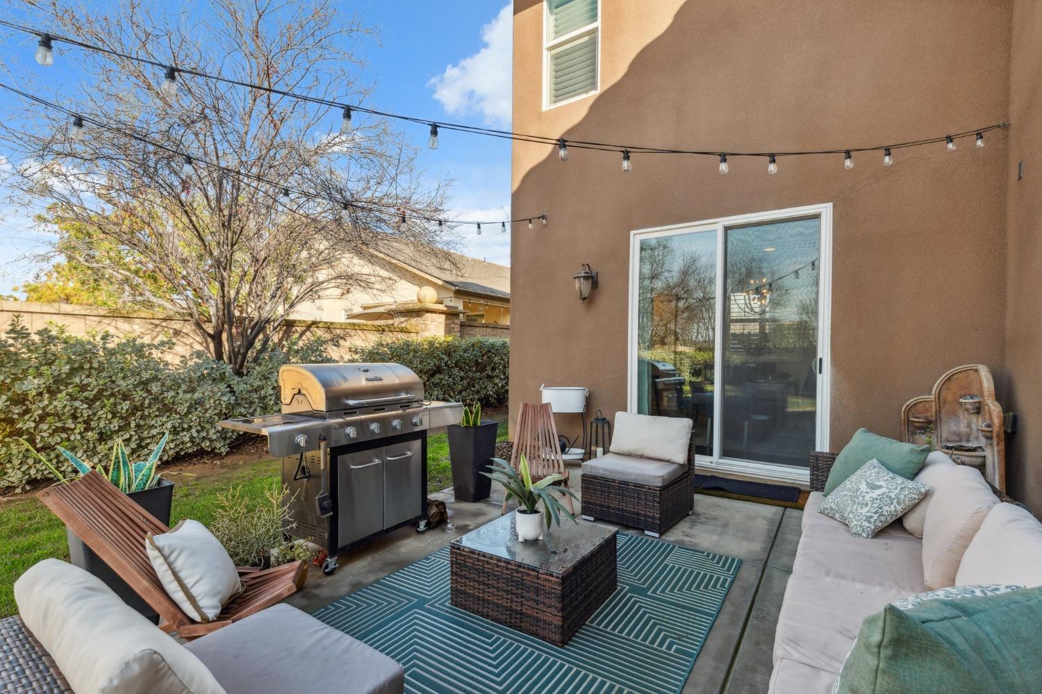 4217 Salem Lane Clovis, CA 93619 - Photo 33 of 57 a outdoor living space with furniture and a fireplace