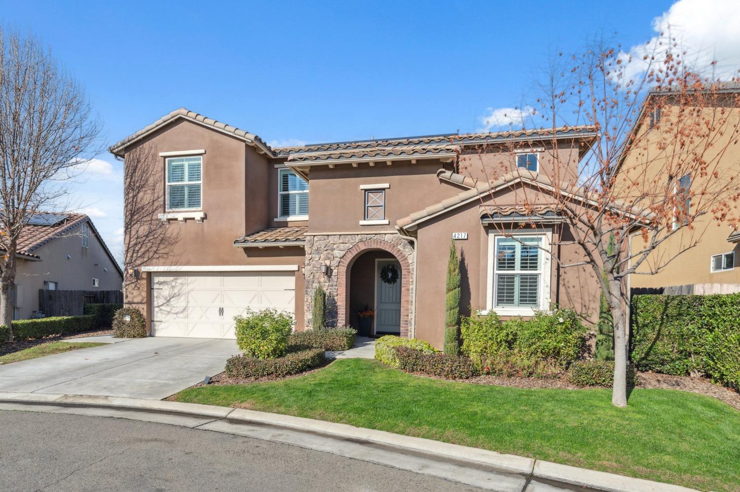 4217 Salem Lane Clovis, CA 93619 - Photo 4 of 57 a front view of a house with garden