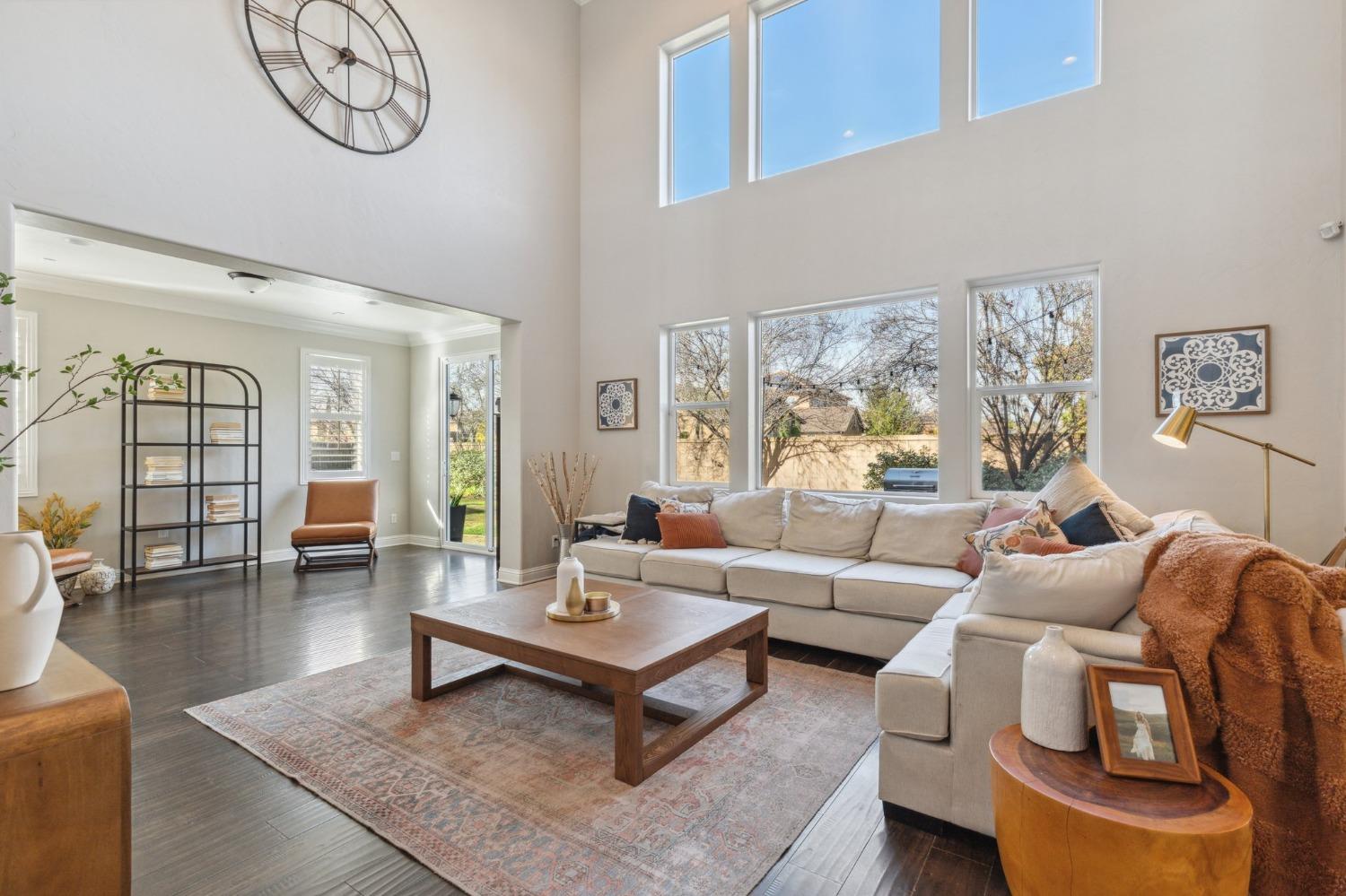 4217 Salem Lane Clovis, CA 93619 - Photo 5 of 57 a living room with furniture a table and a large window