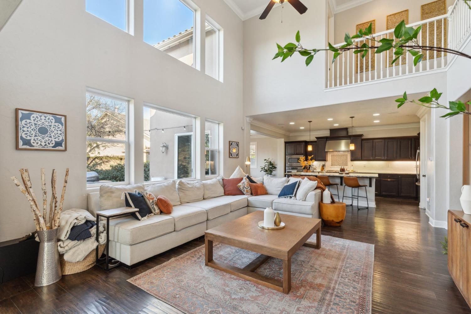 4217 Salem Lane Clovis, CA 93619 - Photo 7 of 57 a living room with furniture wooden floor and a large window