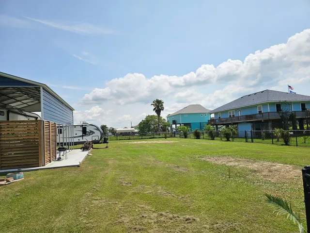 a view of a big yard with a house