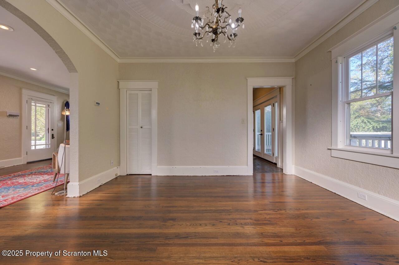 120 Glenburn Road Clarks Green, PA 18411 - Photo 13 of 34 a view of an empty room with wooden floor and a window