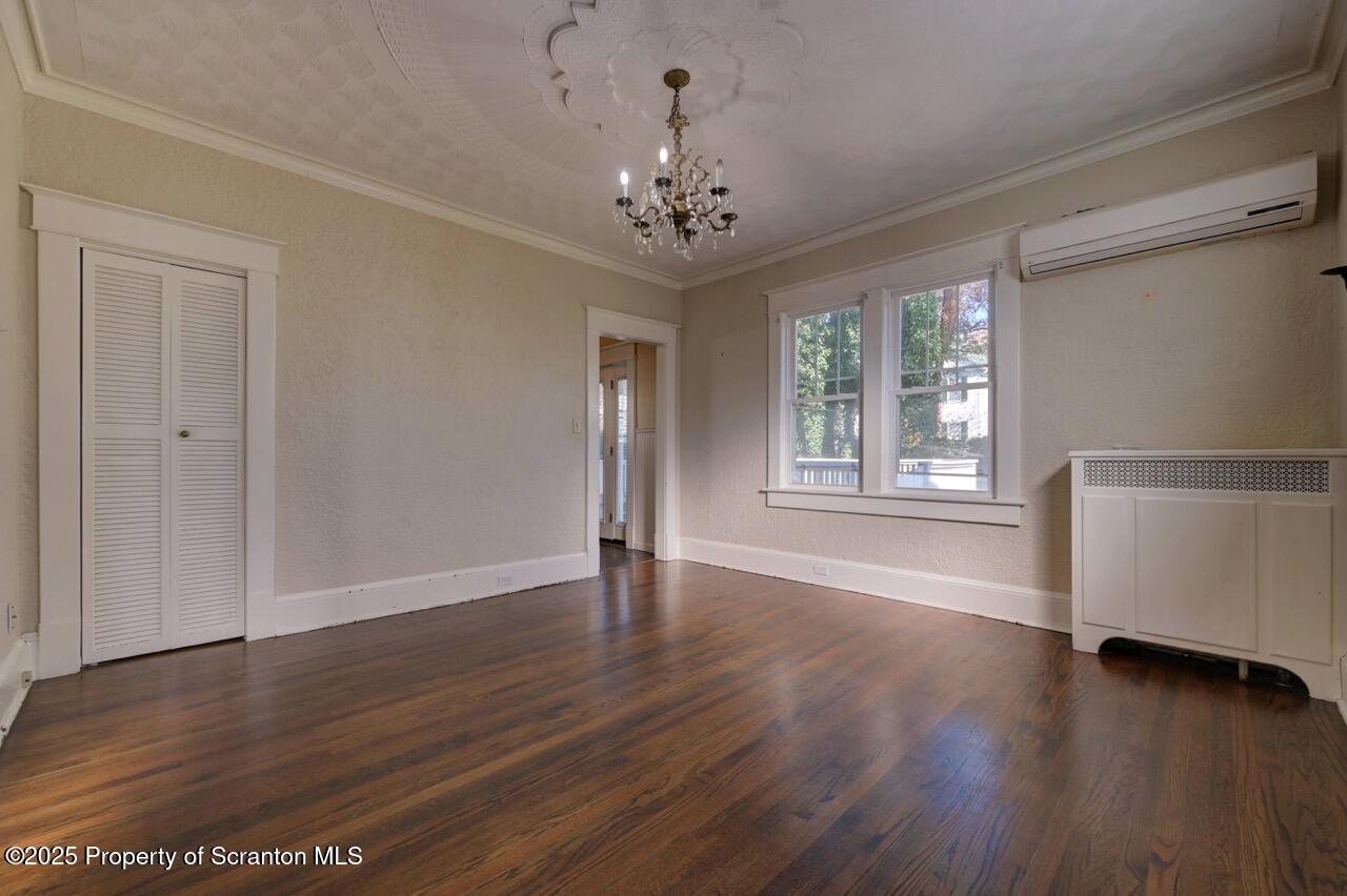 120 Glenburn Road Clarks Green, PA 18411 - Photo 14 of 34 a view of an empty room with wooden floor and a window