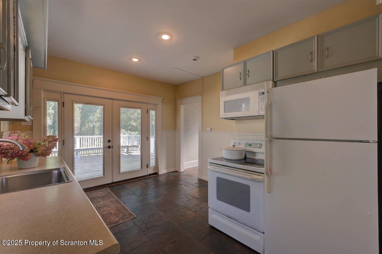 120 Glenburn Road Clarks Green, PA 18411 - Photo 16 of 34 a kitchen with a refrigerator and a stove