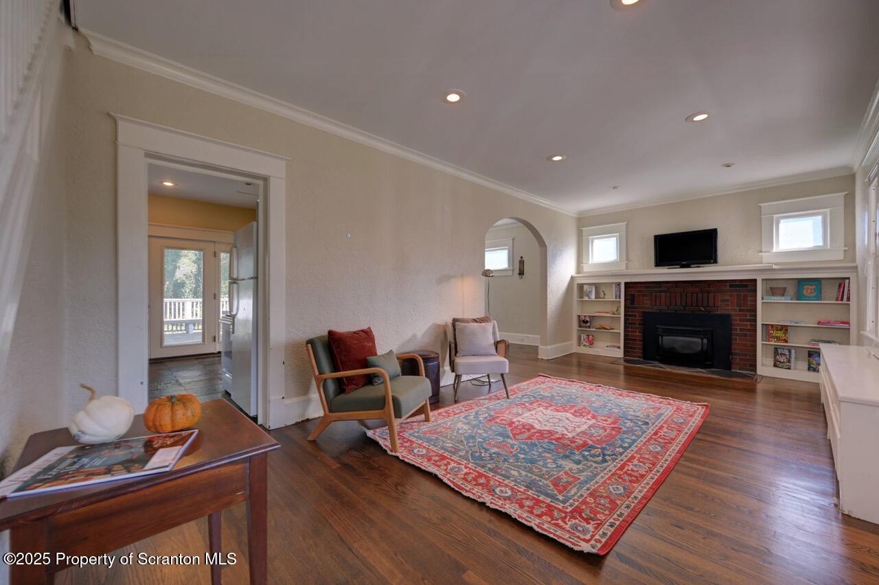 120 Glenburn Road Clarks Green, PA 18411 - Photo 9 of 34 a living room with furniture and a fireplace