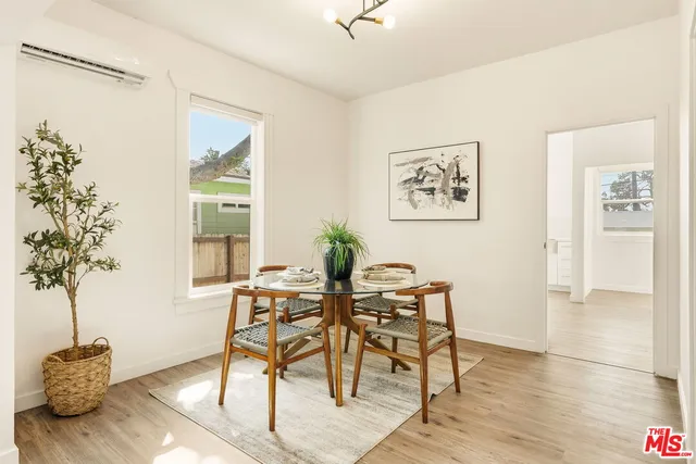 a view of a livingroom with furniture and a potted plant