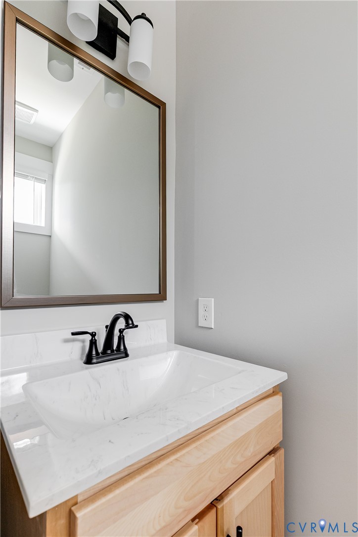 2917 R Street Richmond, VA 23223 - Photo 16 of 35 a bathroom with a sink and a mirror