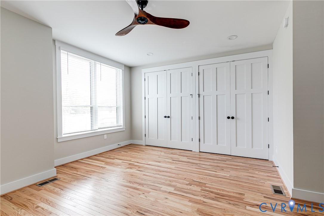 2917 R Street Richmond, VA 23223 - Photo 19 of 35 Unfurnished bedroom with multiple closets, light w