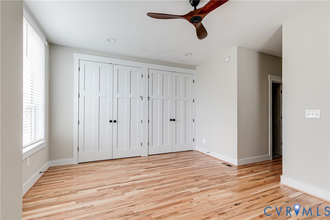 2917 R Street Richmond, VA 23223 - Photo 20 of 35 Unfurnished bedroom featuring two closets, light w