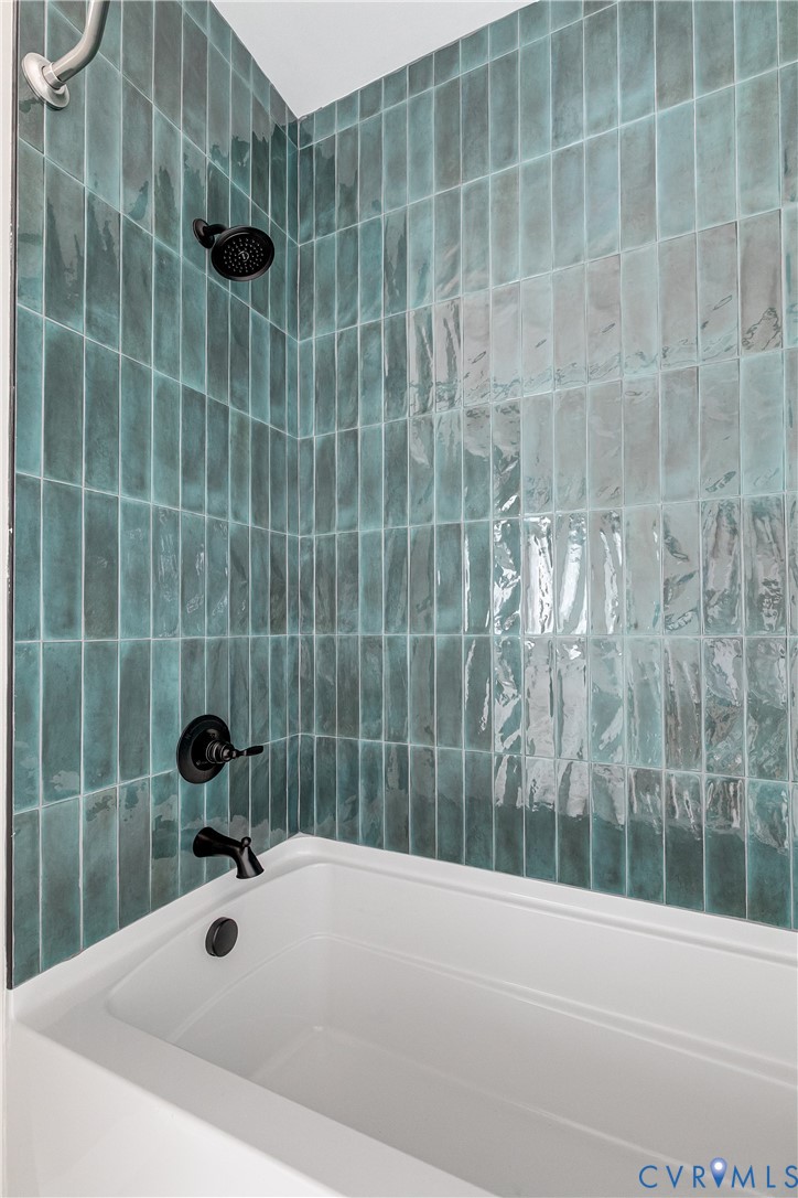 2917 R Street Richmond, VA 23223 - Photo 21 of 35 a bathroom with a sink and a shower