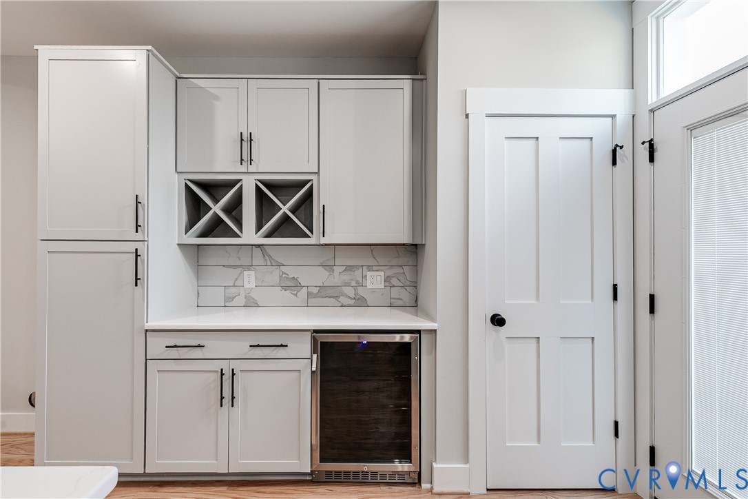 2917 R Street Richmond, VA 23223 - Photo 10 of 35 Indoor dry bar featuring beverage cooler, decorati