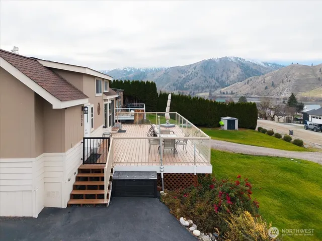 a view of a patio with a table and chairs
