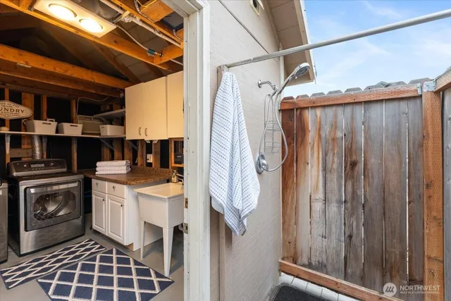 a utility room with dryer and washer