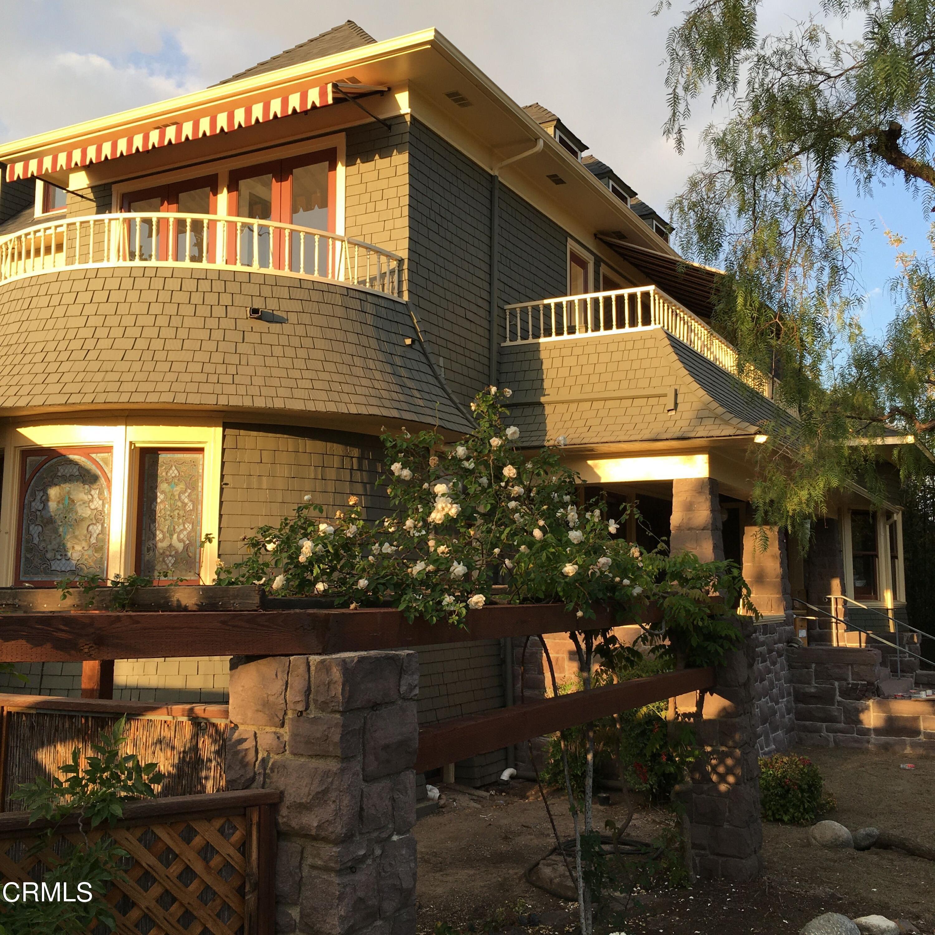 80 Grace Terrace, Unit 5 Pasadena, CA 91105 - Photo 3 of 52 a front view of a house with lots of flowers