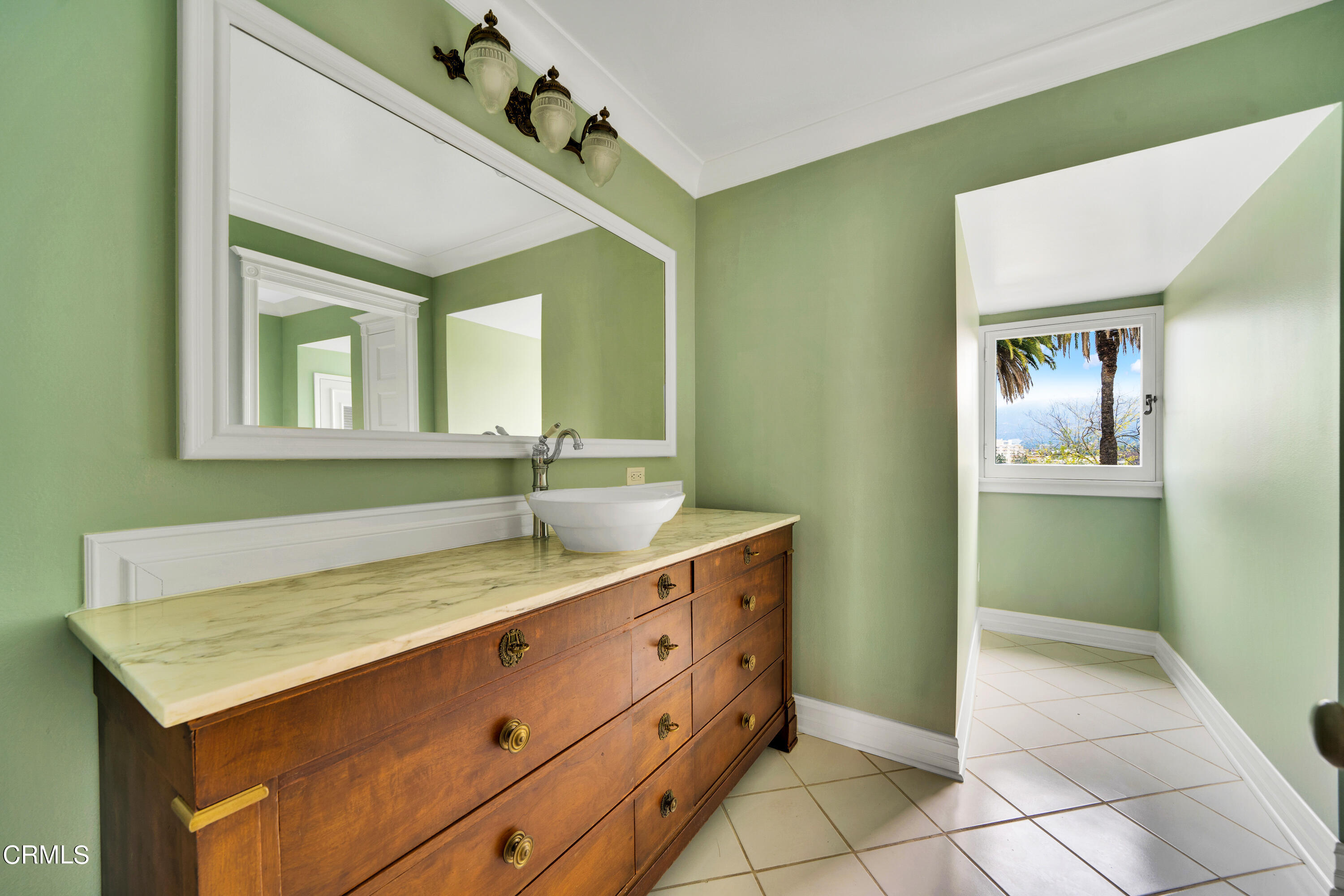 80 Grace Terrace, Unit 5 Pasadena, CA 91105 - Photo 32 of 52 a bathroom with a sink and a mirror