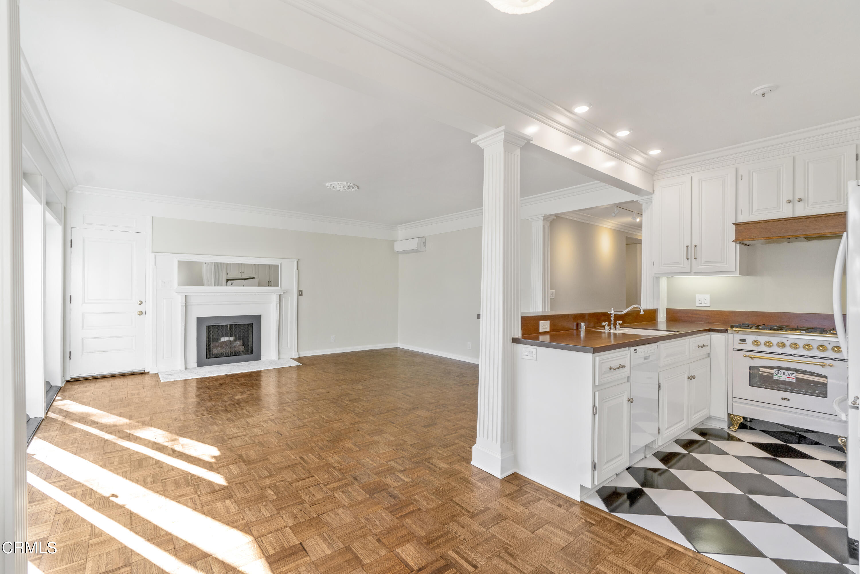 80 Grace Terrace, Unit 5 Pasadena, CA 91105 - Photo 42 of 52 a kitchen with granite countertop a stove top oven a sink and a fireplace