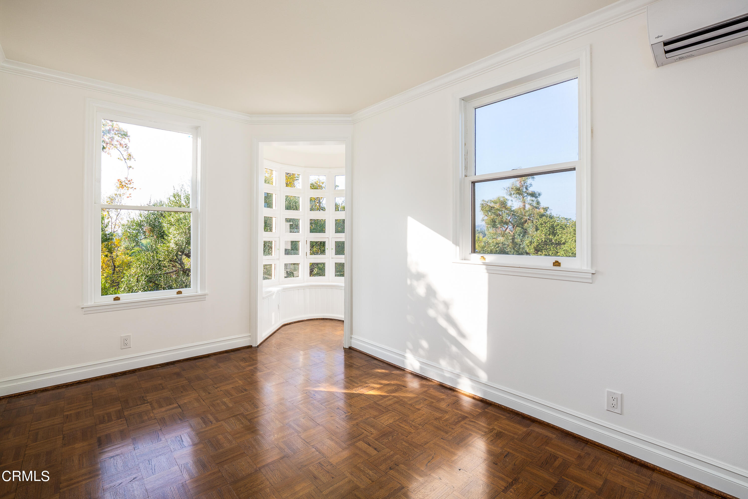 80 Grace Terrace, Unit 5 Pasadena, CA 91105 - Photo 43 of 52 an empty room with wooden floor and windows