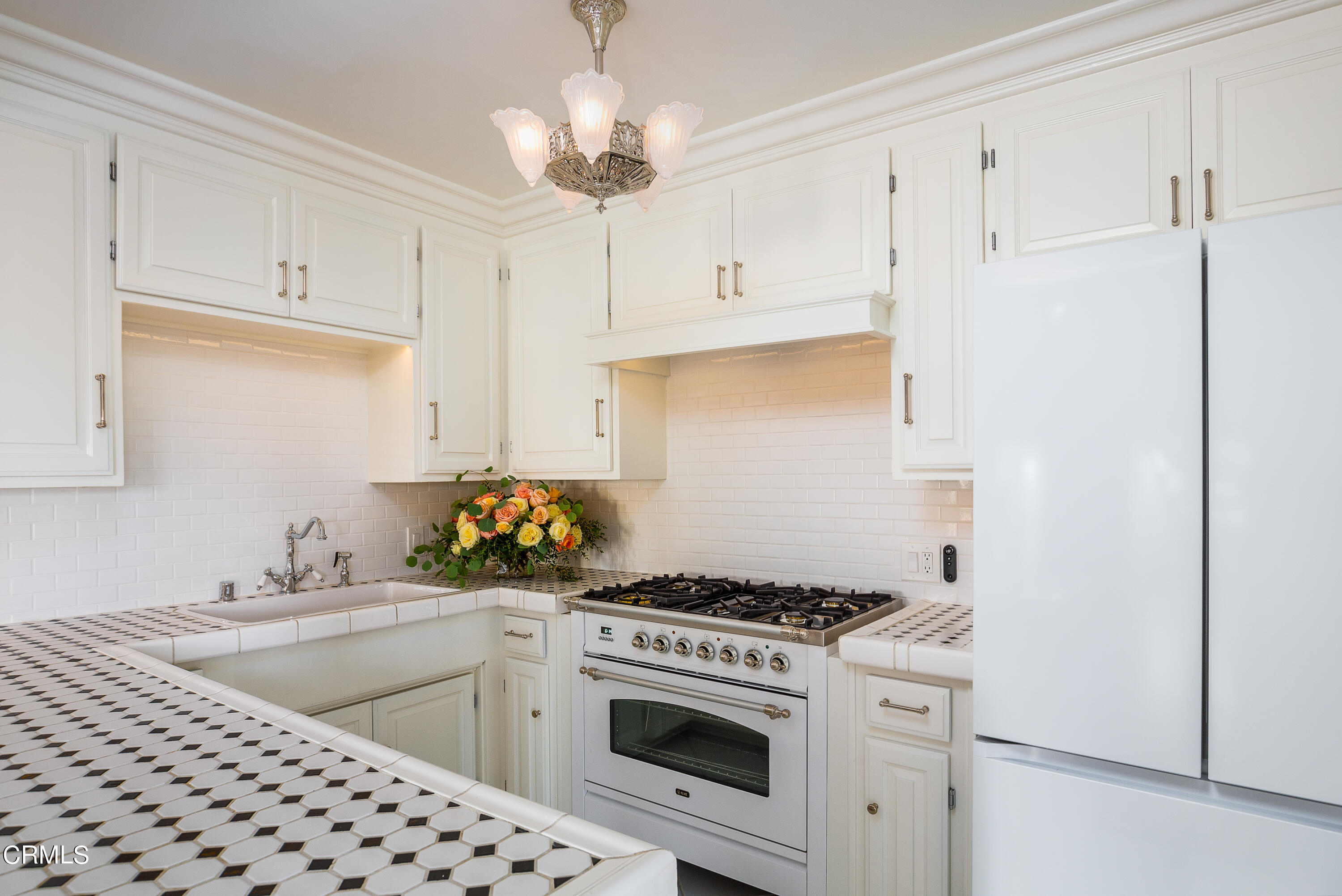 80 Grace Terrace, Unit 5 Pasadena, CA 91105 - Photo 44 of 52 a kitchen with cabinets a washer and dryer