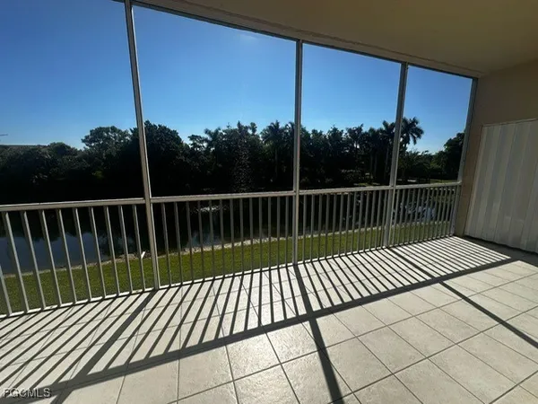 a view of balcony with wooden floor