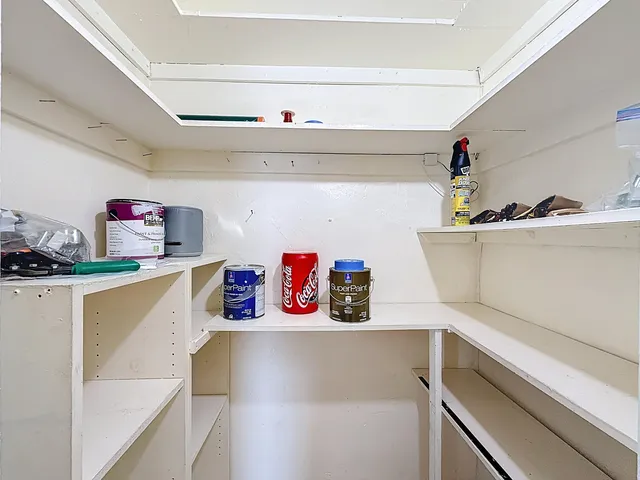 a kitchen with a refrigerator and a sink