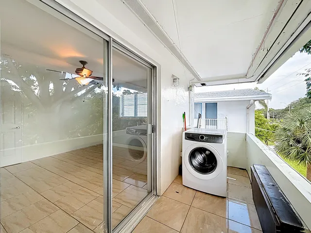 a view of a hallway with washer and dryer