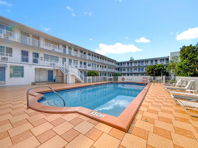 a view of swimming pool with lounge chair