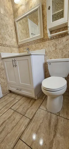a bathroom with a toilet and a sink