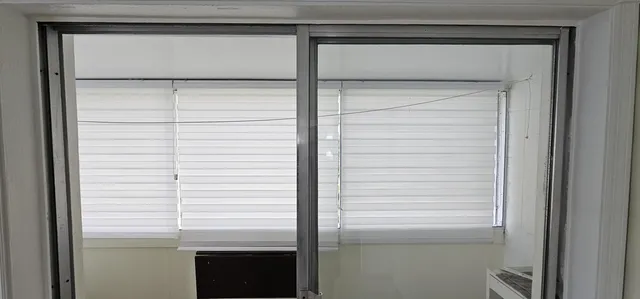 a bathroom with a glass shower door