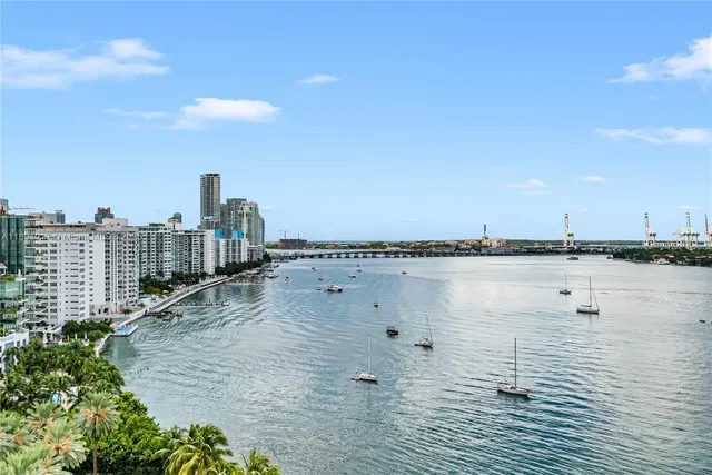 a bedroom with a bed a table and chair
