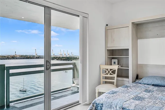 a bedroom with a bed and a walk in closet