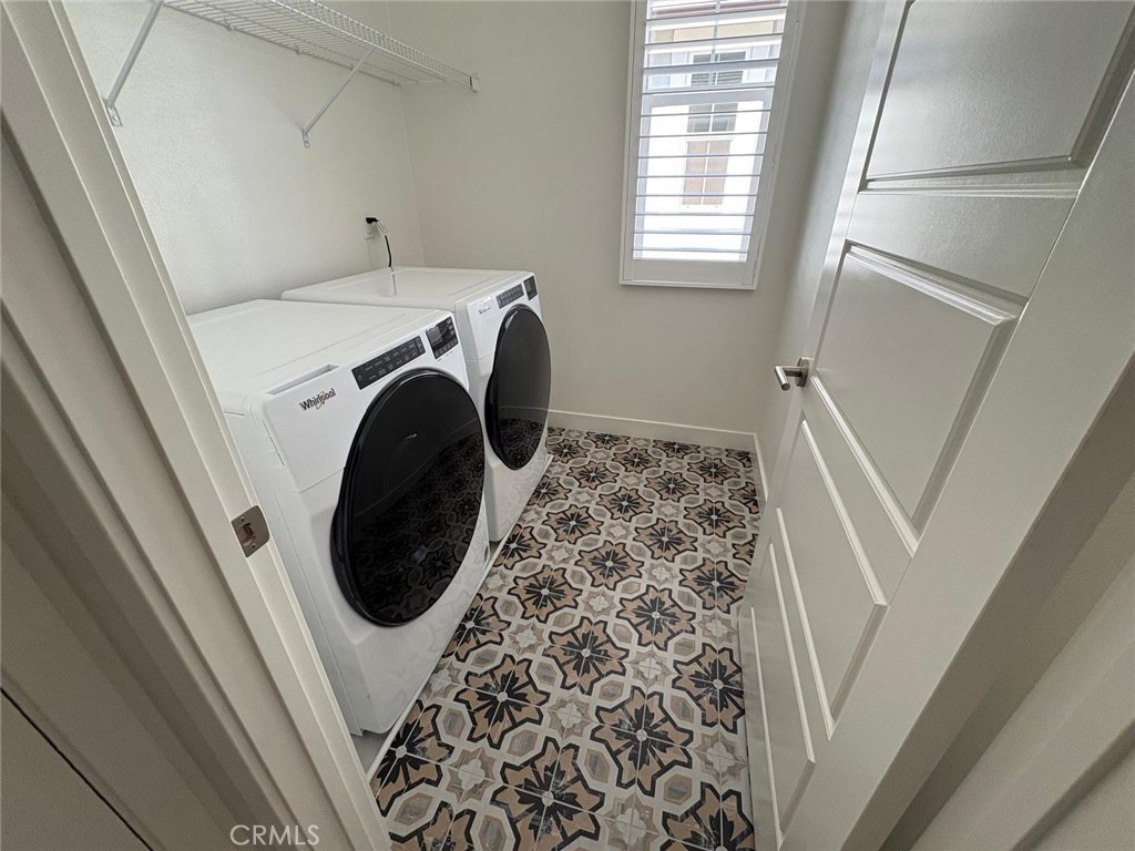 4252 East Sage Paseo, Unit 132 Ontario, CA 91761 - Photo 5 of 7 a utility room with dryer and washer