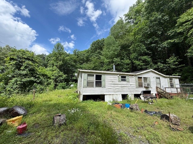 115 Calvender Road Turtletown, TN 37391 - Photo 22 of 23 a view of a house with a big yard and large trees