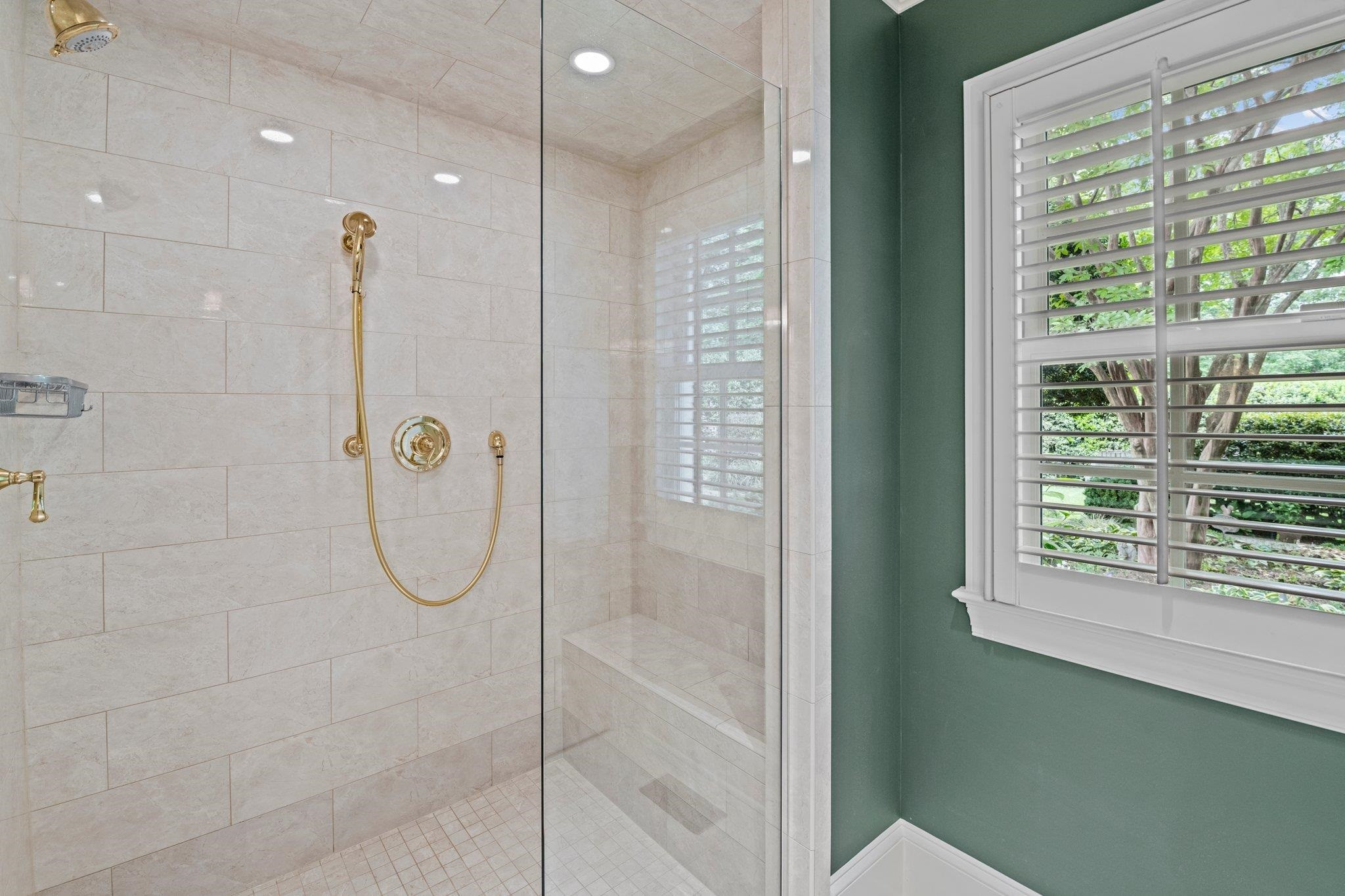 2217 St Marys Street Raleigh, NC 27608 - Photo 22 of 52 Close up view of the frameless, curbless walk-in shower in the owner's suite on the main level. Framless Curbless Walk-In Shower