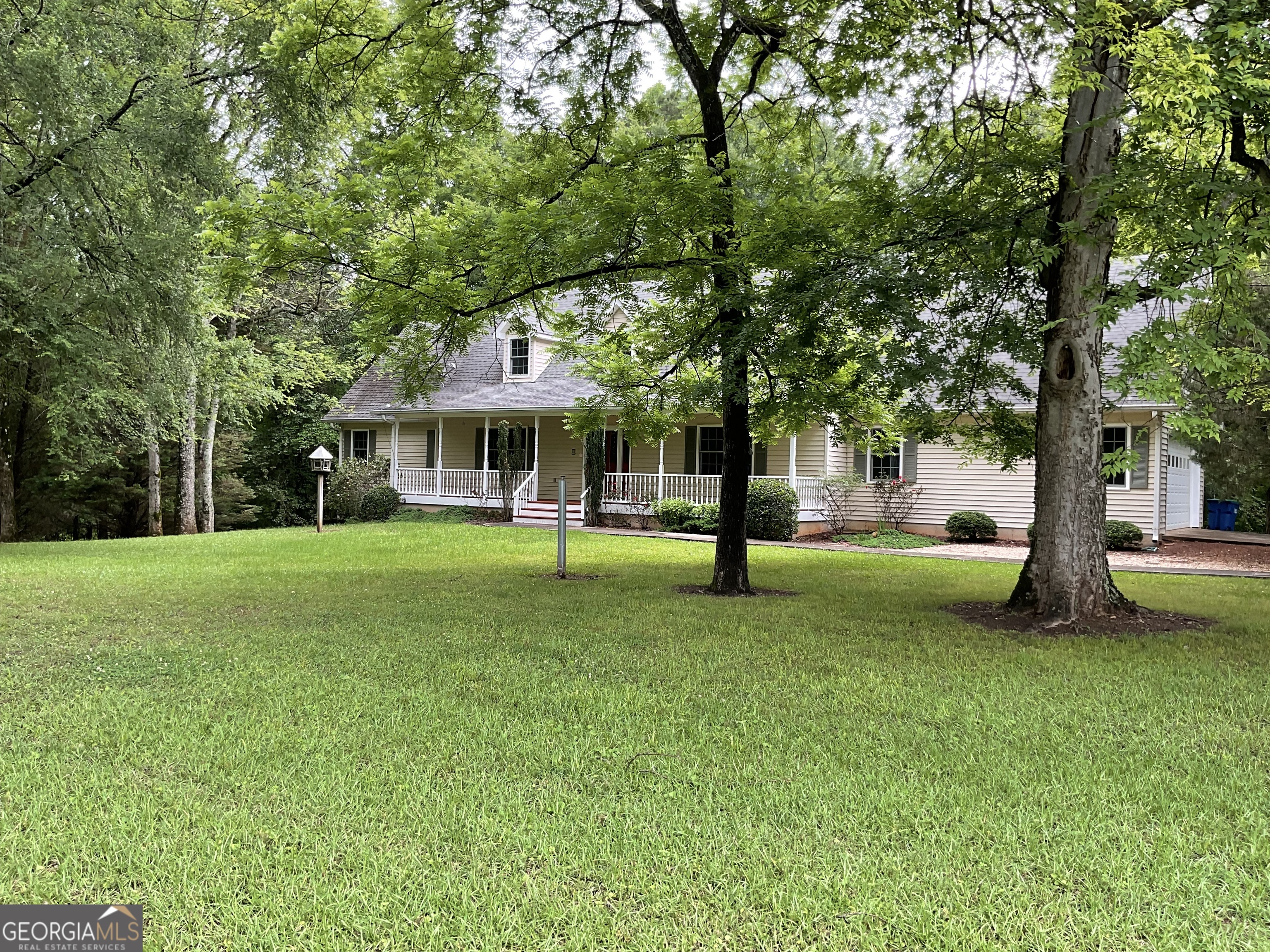 4800 Bethlehem Road Fairburn, GA 30213 - Photo 10 of 49 a view of a house with a backyard