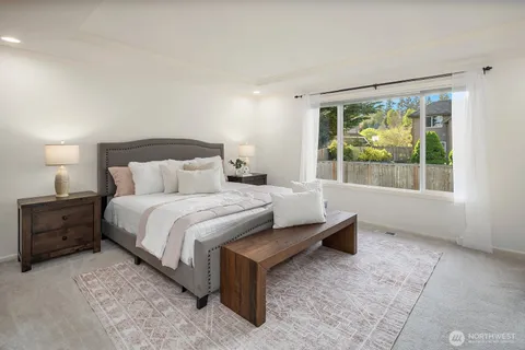 a bed room with a bed and a window