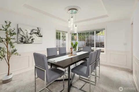 a view of a dining room with furniture window and outside view