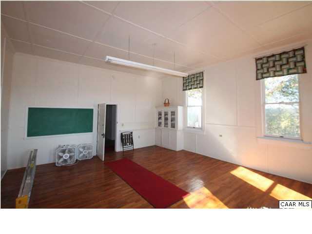 4805 Orange Road Aroda, VA 22709 - Photo 4 of 12 a bedroom with a bed mirror and window