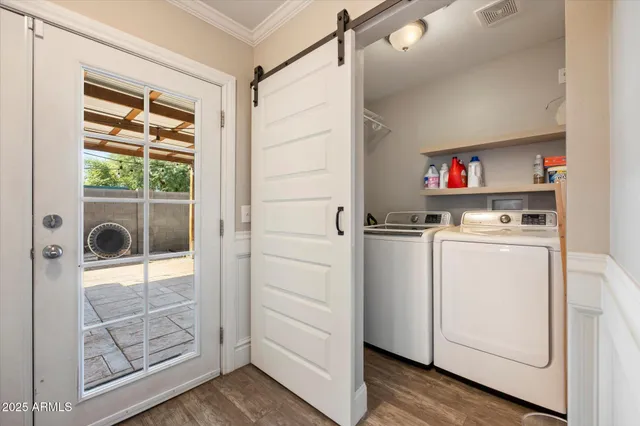 a utility room with closet dryer and washer