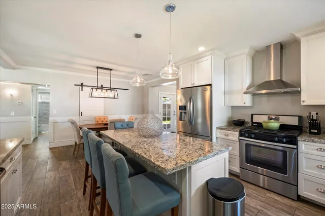 a kitchen with a stove a refrigerator and a refrigerator